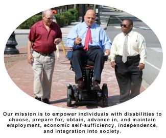 Image of two men walking and one in wheelchair on sidewalk